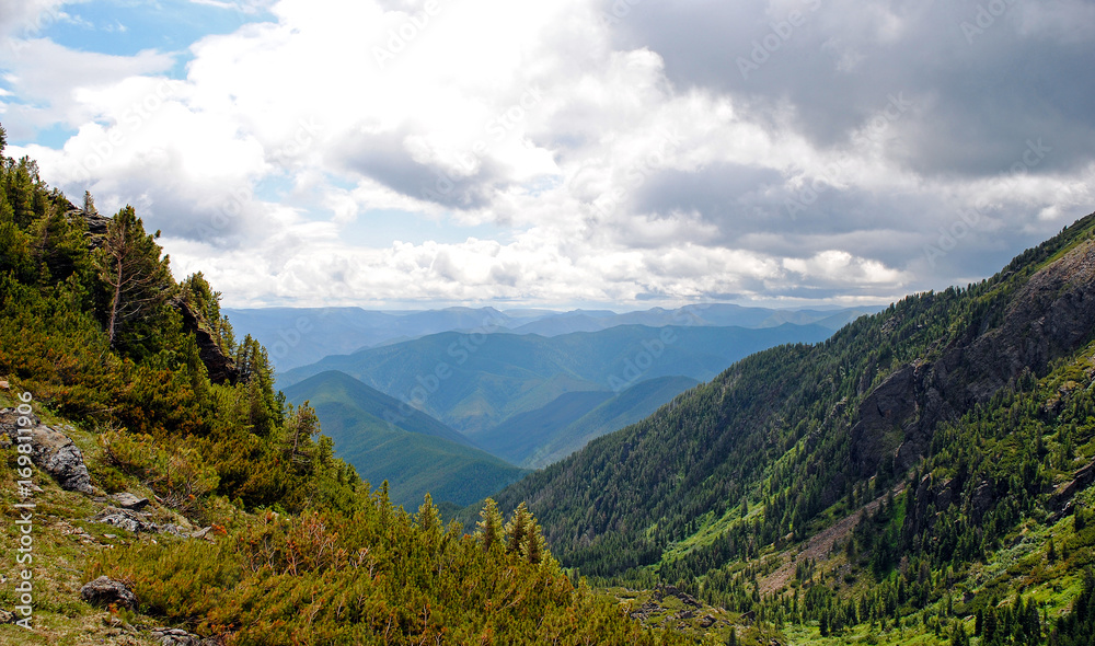 Obraz premium Summer mountain landscape. View of the hills and meadows on Lake Baikal, Russia