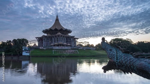 SARAWAK - JUNE 29: A panning to the left footage of burning sky sunrise with the background view of Sarawak State Legislative Assembly on June 29, 2017 in Sarawak.
