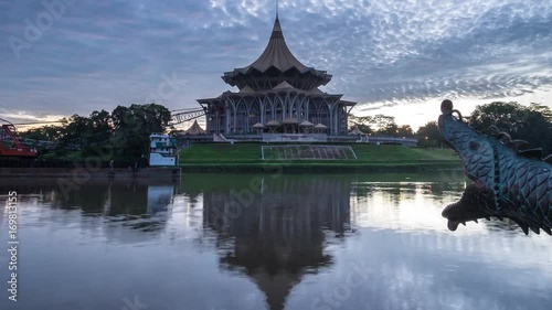 SARAWAK - JUNE 29: A panning up footage of burning sky sunrise with the background view of Sarawak State Legislative Assembly on June 29, 2017 in Sarawak.