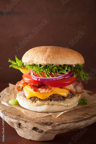 bacon cheese burger with beef patty, tomato, onion