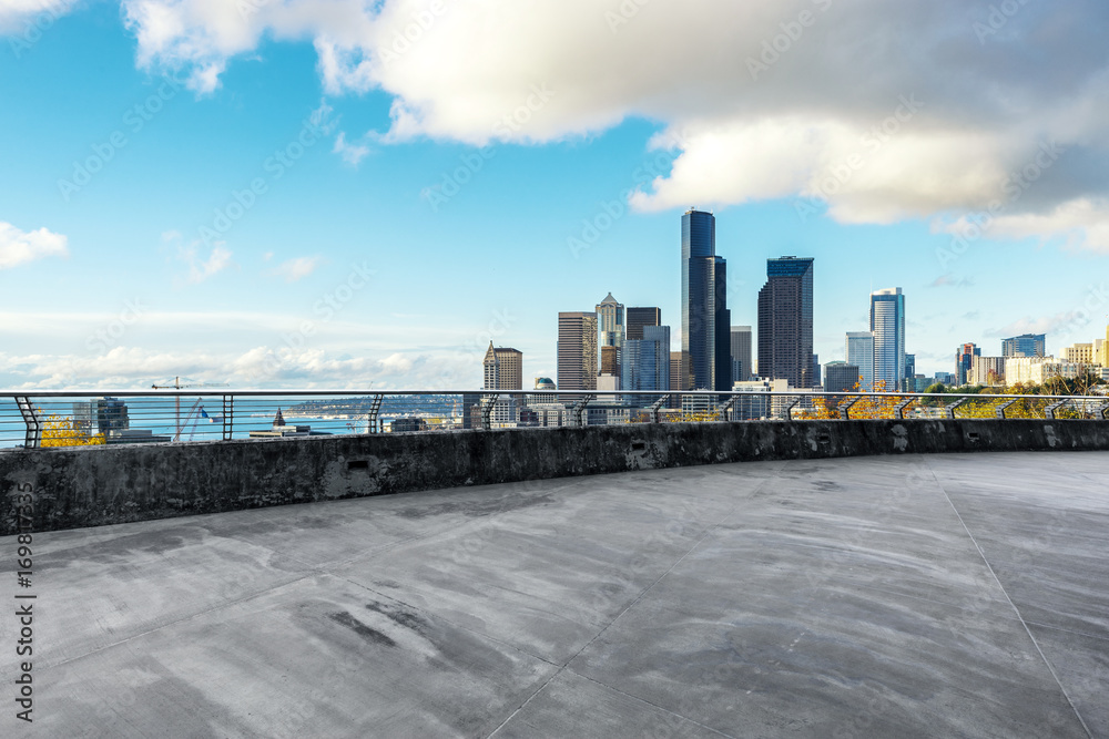 empty concrete road with cityscape of modern city in blue sky empty concrete road with cityscape of modern city in blue sky