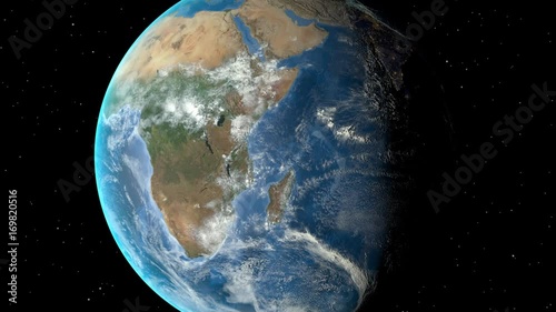Night to day - rotating Earth. Zoom in on Zambia outlined photo