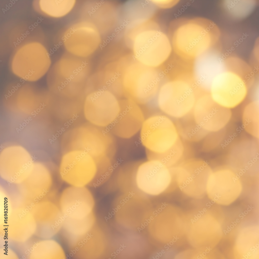 Golden Christmas background with natural  bokeh and twinkled defocused lights. Festive blur background .