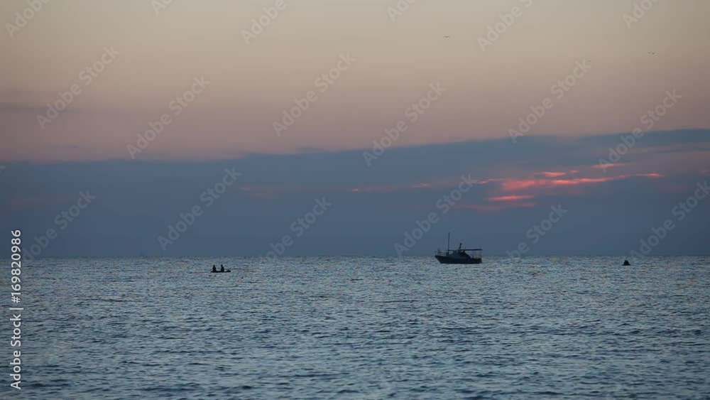 Ocean wave water surface with rising sun reflection. Florida, USA