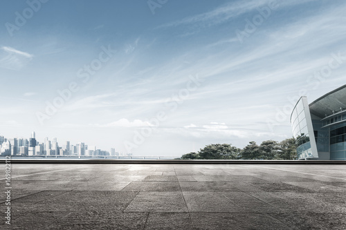 empty marble floor with cityscape of modern city photo