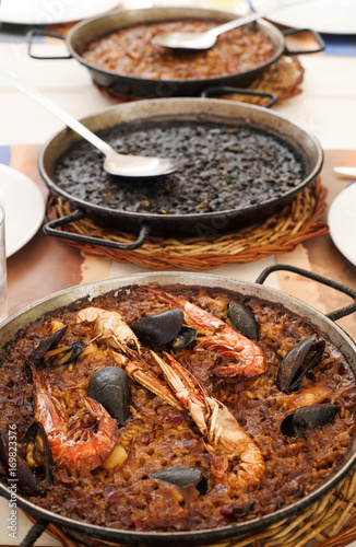spanish seafood paella, black paella and fideua