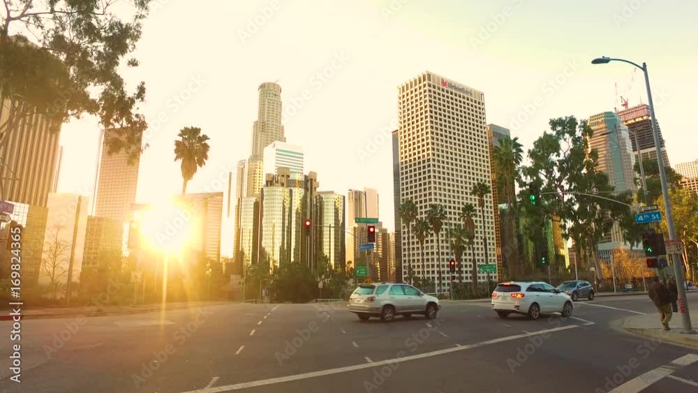 Down Town Los Angeles Driving plates buildings with lights with traffic on sun set warm colors