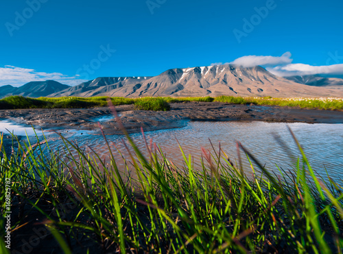 Tableau sur toile Landscape of a nature grass of a  sunset sky with clouds in the mountains of Spi