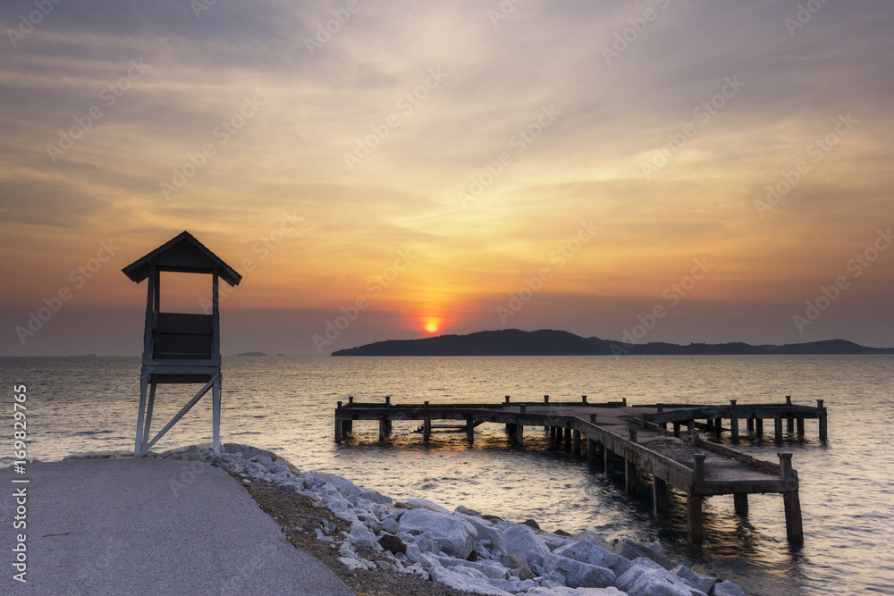 sunrise seascape with tower observation old small Located at the end of the road Behind Older port and sea in the khao laem ya ,mu ko samet national park ,thailand. - obrazy, fototapety, plakaty 