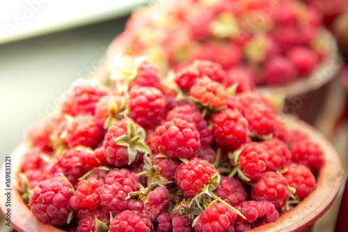 Raspberry bucket at village market photo