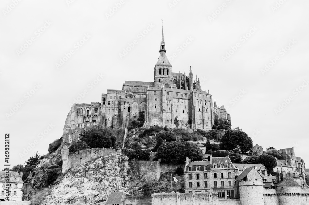 Monumental medieval Abbey of Mont-Saint-Michel in Normandy, France. Black and white image