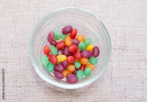 Colorful candies on a brown background