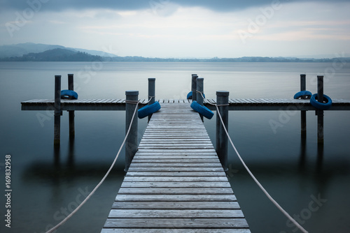 Evening time. Wooden pier on the lake. © patma145