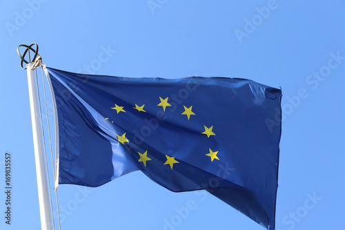 european flag with yellow stars and blue sky