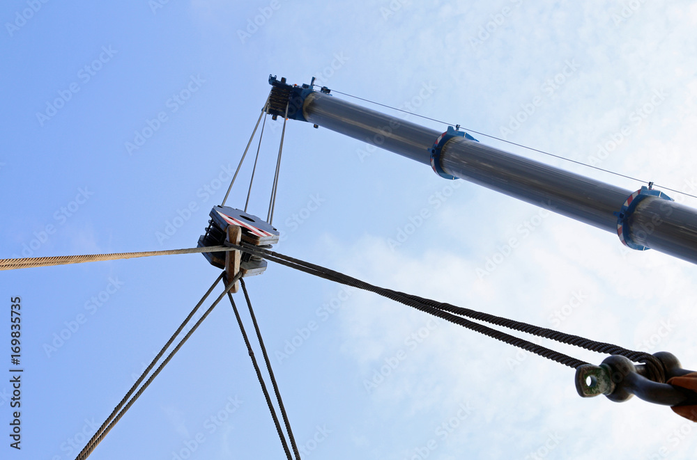 big hydraulic arm of a powerful crane for lifting loads big hydraulic arm of a powerful crane for lifting loads