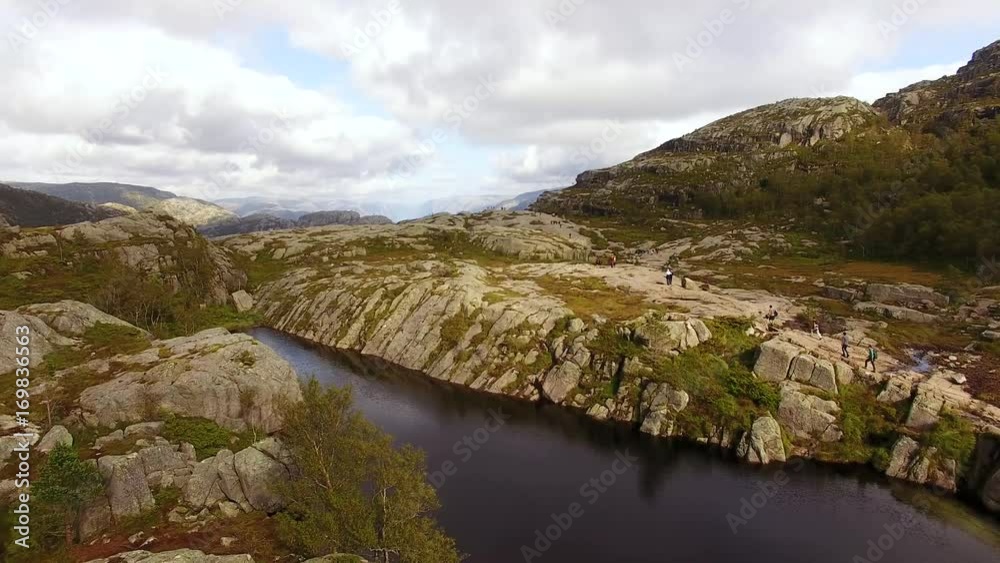Tourists are hiking to the Pulpit Rock in Norway, summertime Tourists are hiking to the Pulpit Rock in Norway, summertime