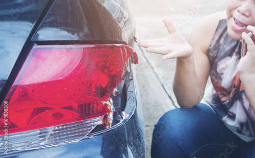 Billede på lærred Lady using phone calling insurance agent for car accident claim process