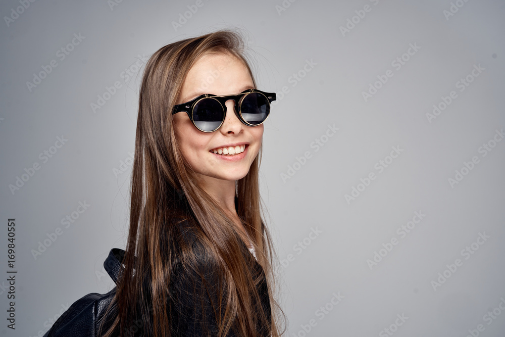 beautiful girl in sunglasses smiling, child, blank space for copy beautiful girl in sunglasses smiling, child, blank space for copy