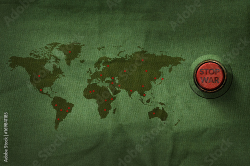Stop War Concept, Button to push on World Map Military Fabric Texture background