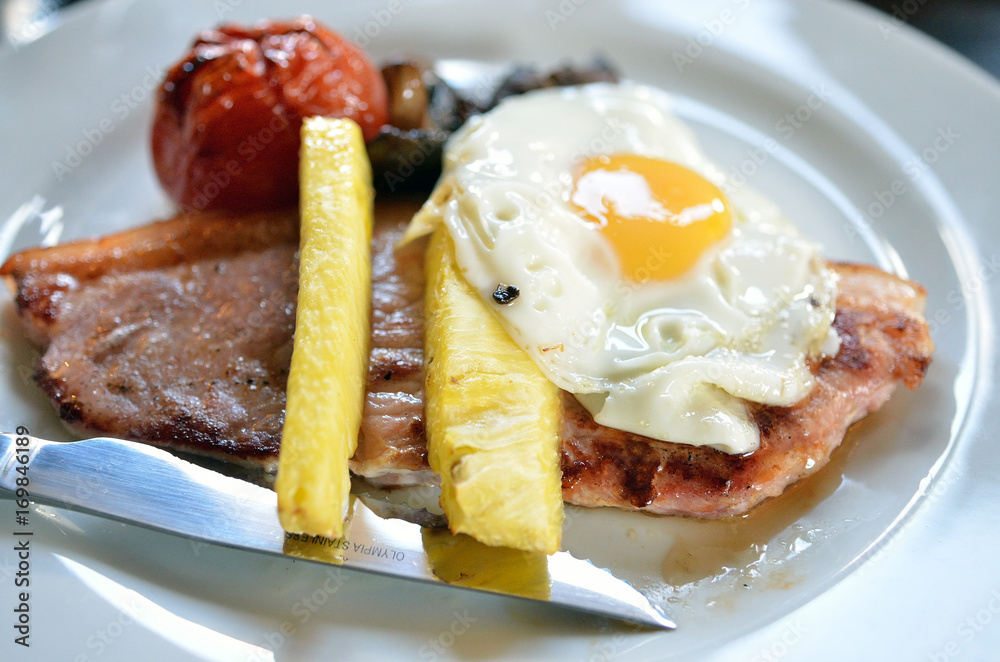 Grilled pork steak with egg on top.. Grilled pork steak with egg on top..