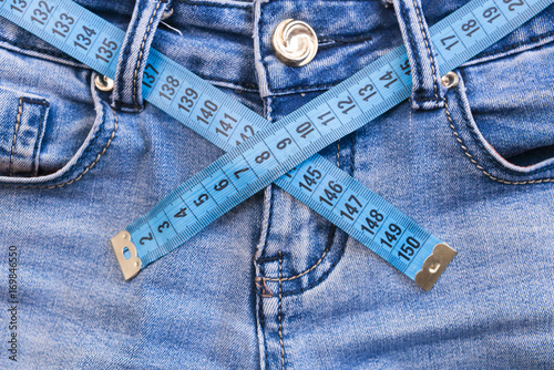 Jeans and measuring tape - slimming concept