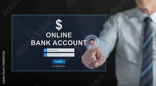 Man touching an online bank account website on a touch screen