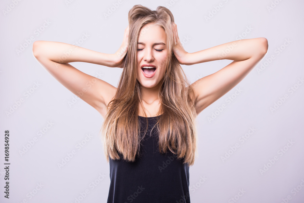 head portrait of young beautiful surprised woman amazed in shock and surprise with mouth big opened isolated grey background in astonished face expression head portrait of young beautiful surprised woman amazed in shock and surprise with mouth big opened isolated grey background in astonished face expression