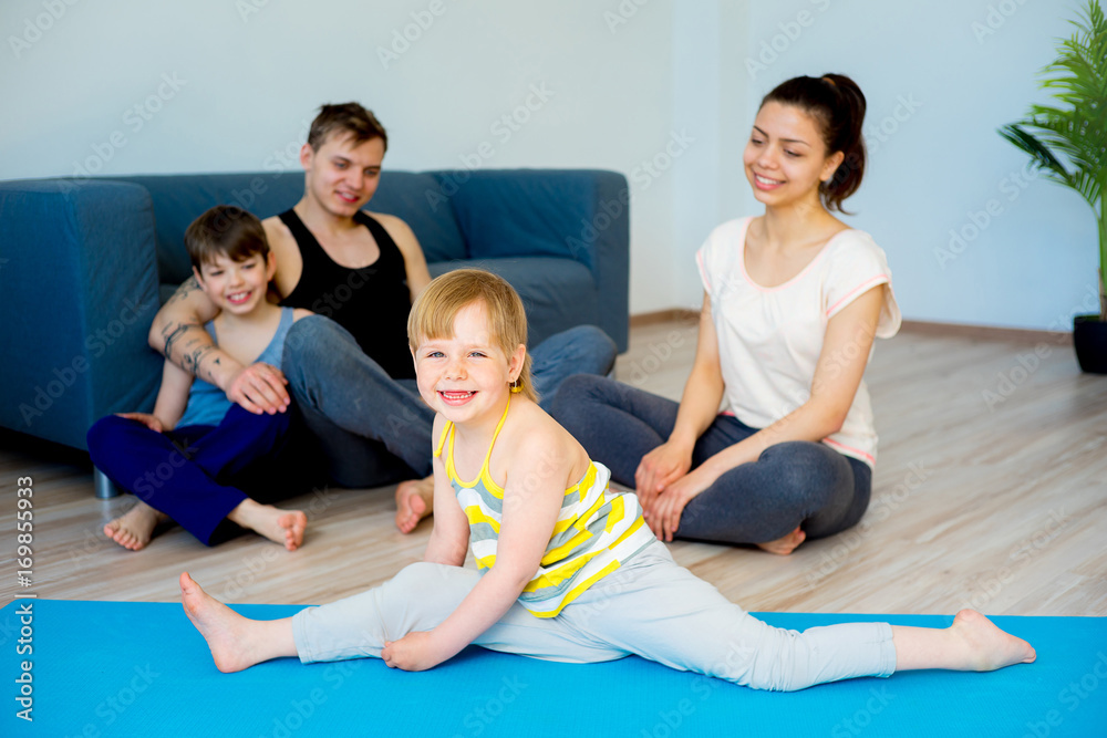 Family doing exercises together Family doing exercises together