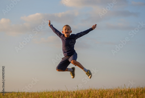 European boy in a joyful jump