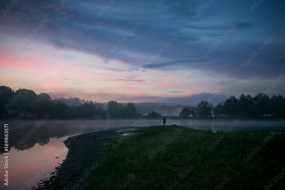 Fototapeta premium Romantic sky under lake during early foggy morning