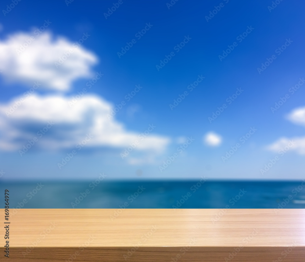 Wood Table Top on Abstract Blur Natural Blue Summer Sky with Whi