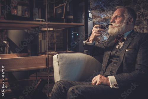 Senior man with a smoking pipe