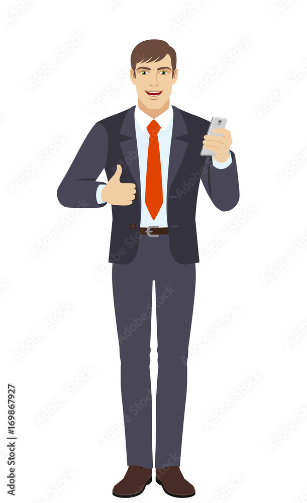 Businessman with mobile phone showing thumb up