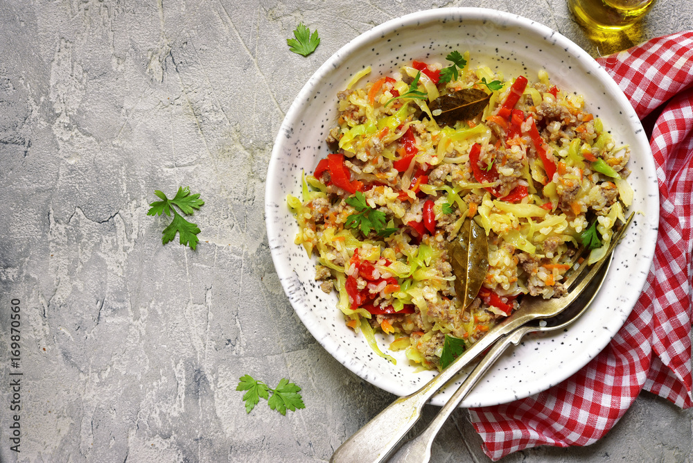 Cabbage stewed with bell pepper,minced meat and rice.Top view. Cabbage stewed with bell pepper,minced meat and rice.Top view.