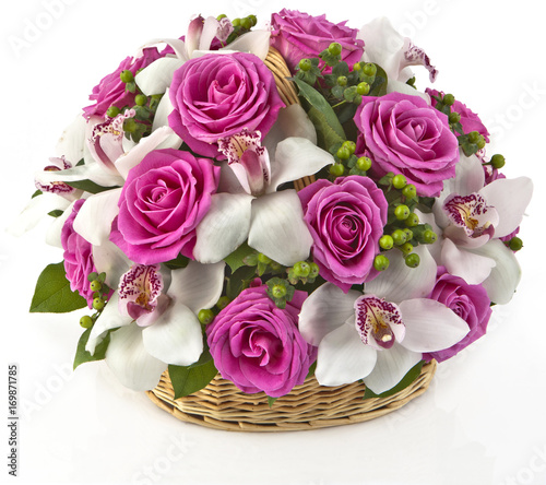bouquet of pink roses  and lilias in basket  on white background