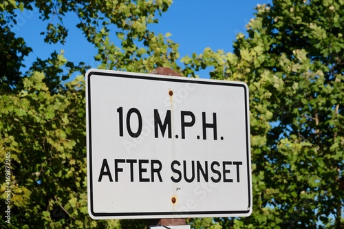 The speed limit sign after sunset sign.