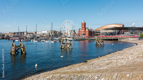 CARDIFF/UK - AUGUST 27 : Ferris Wheel and Pierhead Building in Cardiff on August 27, 2017. Unidentified people photo