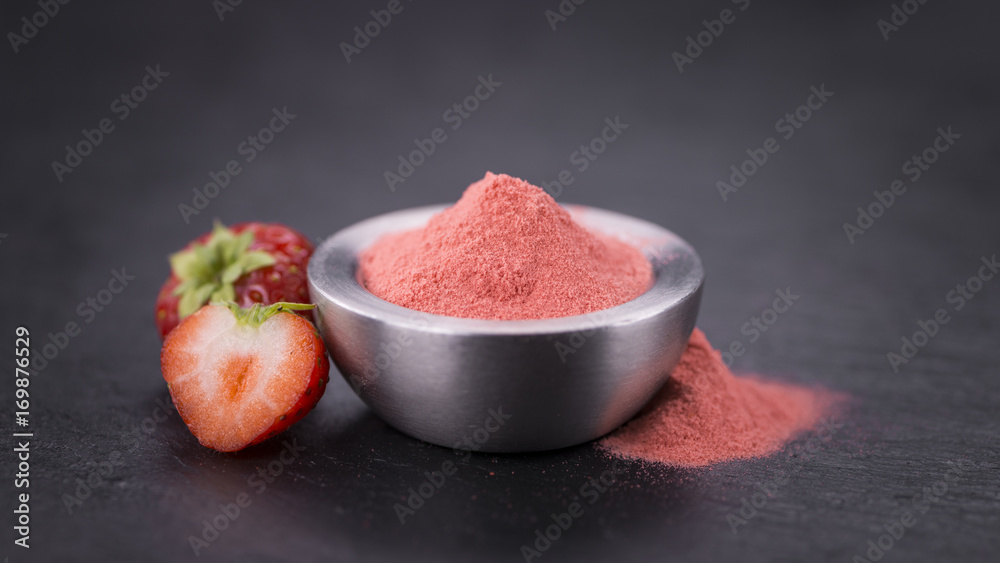 Portion of Strawberry powder on a slate slab Portion of Strawberry powder on a slate slab