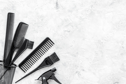 styling hair with combs and tools in barbershop on stone background top view mock-up