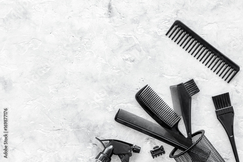 styling hair with combs and tools in barbershop on stone background top view mock-up
