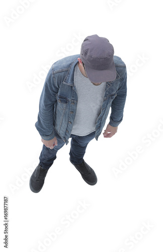 view from above. guy in a baseball cap and denim jacket
