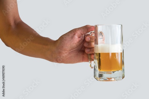 hand holding a glass of beer isolated on white background