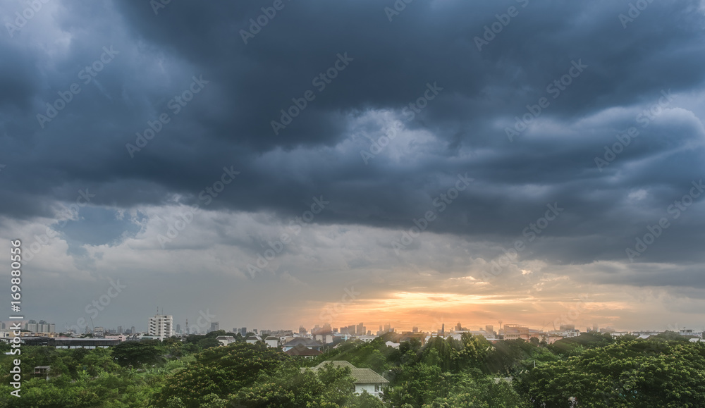 Sunset with cloudy sky over the city