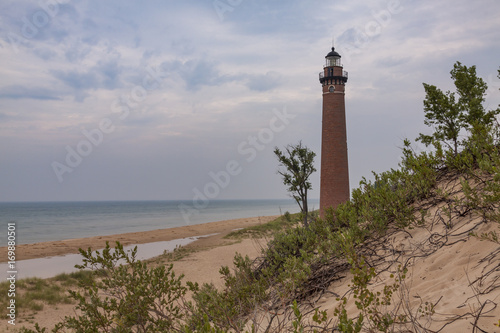 Little Sable Lighthouse / A lighthouse on a beach along Lake Michigan.