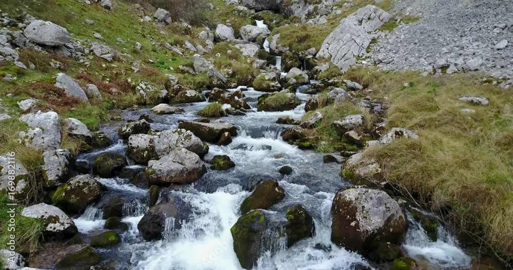 Flying over a stream at Picos de Europa Flying over a stream at Picos de Europa