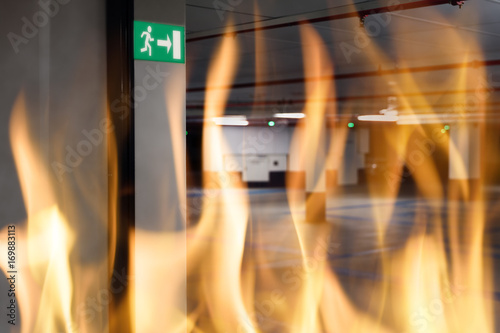 Fire against emergency exit sign