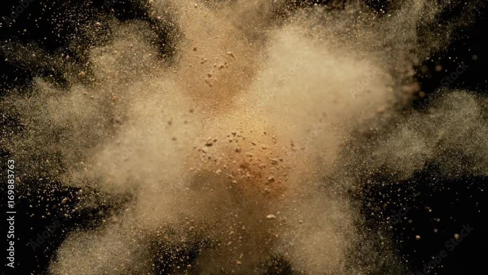 Colorful powder/particles fly after being exploded against black background. Shot with high speed camera, phantom flex 4K. Slow Motion. Unedited version is included at the end of clip.