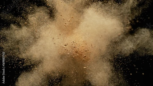 Colorful powder/particles fly after being exploded against black background. Shot with high speed camera, phantom flex 4K. Slow Motion. Unedited version is included at the end of clip.