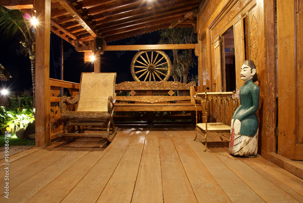 Classical terrace of Javanese house with antique wooden furniture Classical terrace of Javanese house with antique wooden furniture