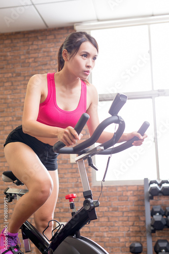 woman use exercise bike © ryanking999